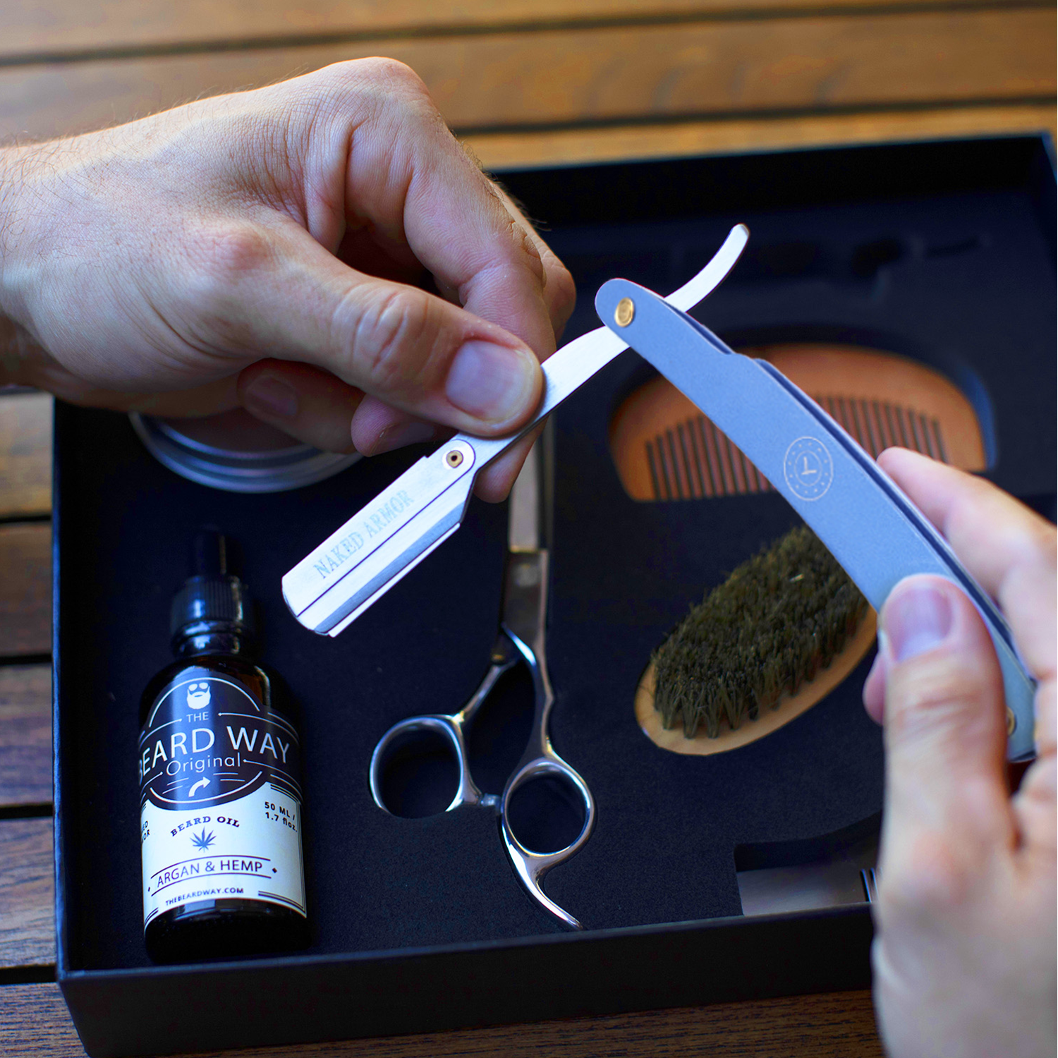 Naked Armor Shavette Titanium With Blue Handle.